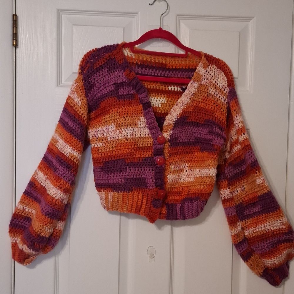 Handknit crop cardigan sz S" with long puff sleeves in shades of rust, purple.